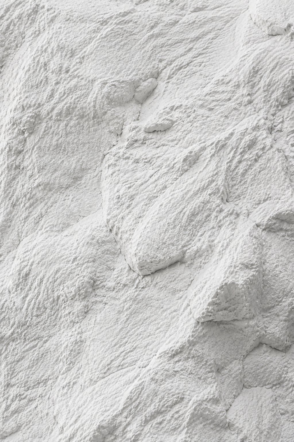 Close view of Rocky White PU Stone panel texture