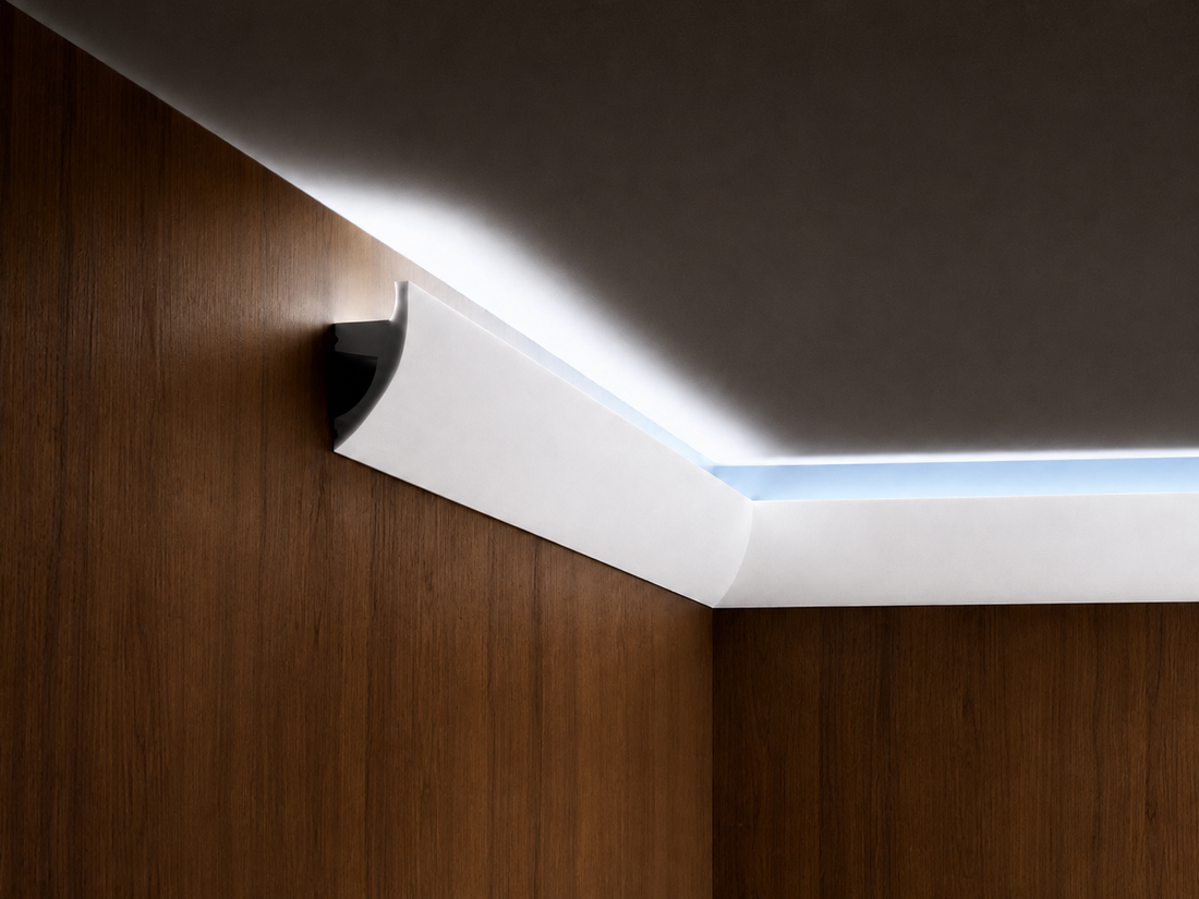Curved white LED baseboard profile in a modern interior