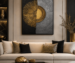 Wallsmark INC geometric abstract wall art on wall panel behind beige sofa with black and gold pillows.