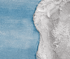White plaster and smooth blue decorative wall panel with coastal-inspired abstract texture and finish.