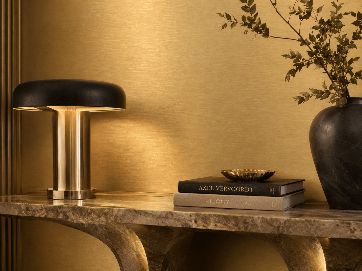 Brushed gold metallic wall panel in a premium interior