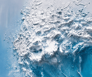 Blue wave wall art featuring raised texture, white foam detail, and a pale sky background.