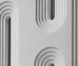 Lightweight architectural wall panel with curved geometric pattern resembling stone in a modern concrete finish.