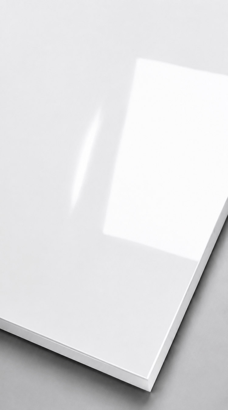 High-Gloss White Wall Panel with reflective finish displayed on a smooth grey surface.
