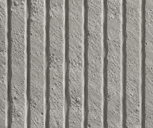 Close-up of Linear Soft Stone, featuring a textured concrete surface with evenly spaced vertical grooves and a rough, grainy finish reminiscent of an architectural wall panel. The lighting accentuates the depth and linear pattern, emphasizing the distinctive look often sought in modern wall cladding designs.