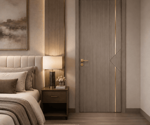 Wallsmark INC taupe door with gold inlay in a modern bedroom with bed, nightstand, lamp, artwork, and wall panel.