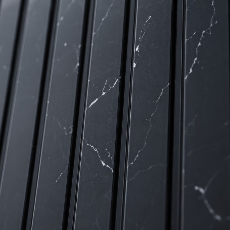 Close-up of Nero Marquina Fluted PS Wall Panel, featuring vertical black marble panels with white veining that form a sleek and modern geometric pattern.