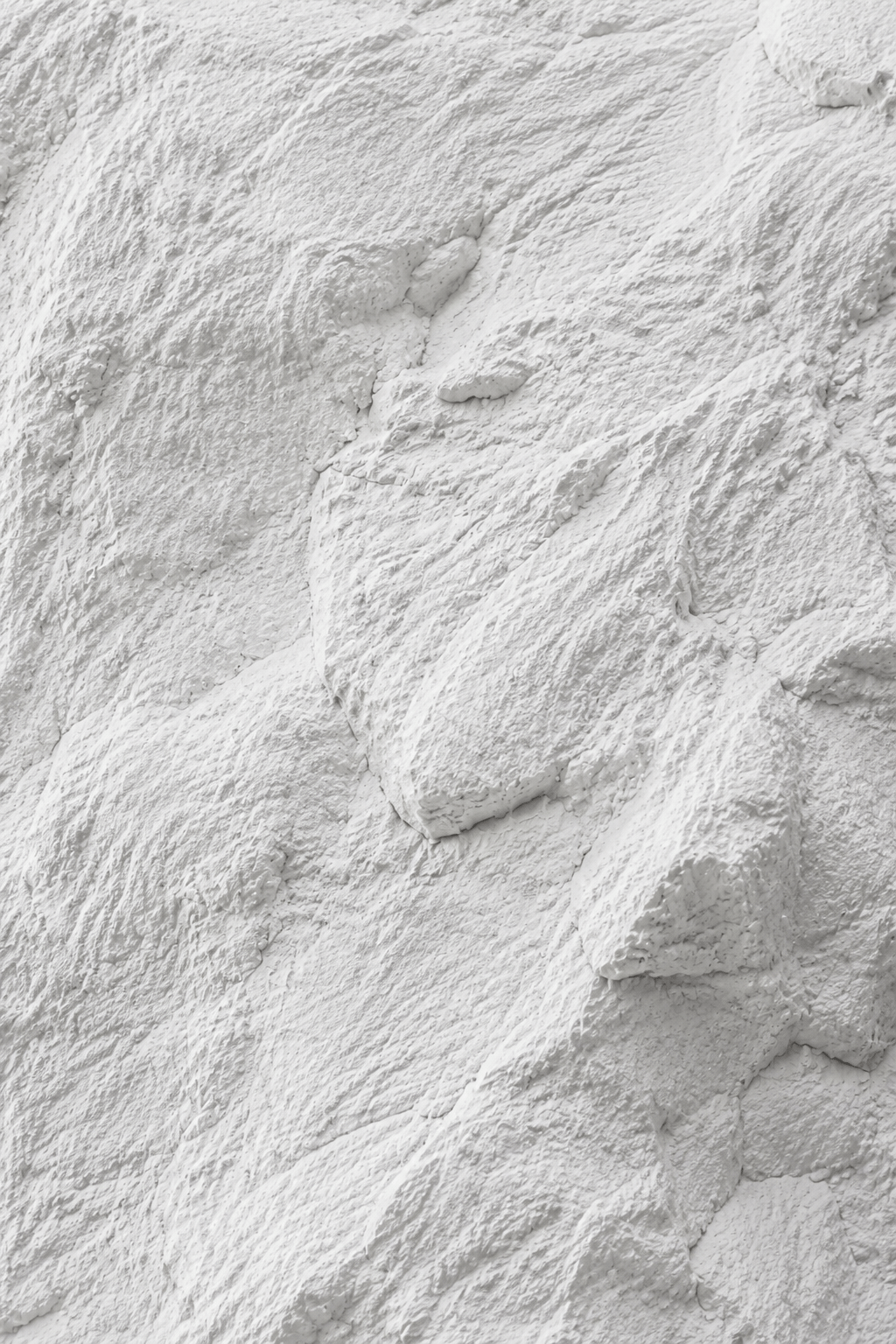 Close view of Rocky White PU Stone panel texture