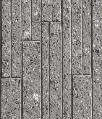 Close-up of the Terraz Soft Stone wall panel featuring textured gray rectangular blocks arranged in a staggered, geometric pattern. The surface displays small pits and speckles, creating a rough and uneven appearance.